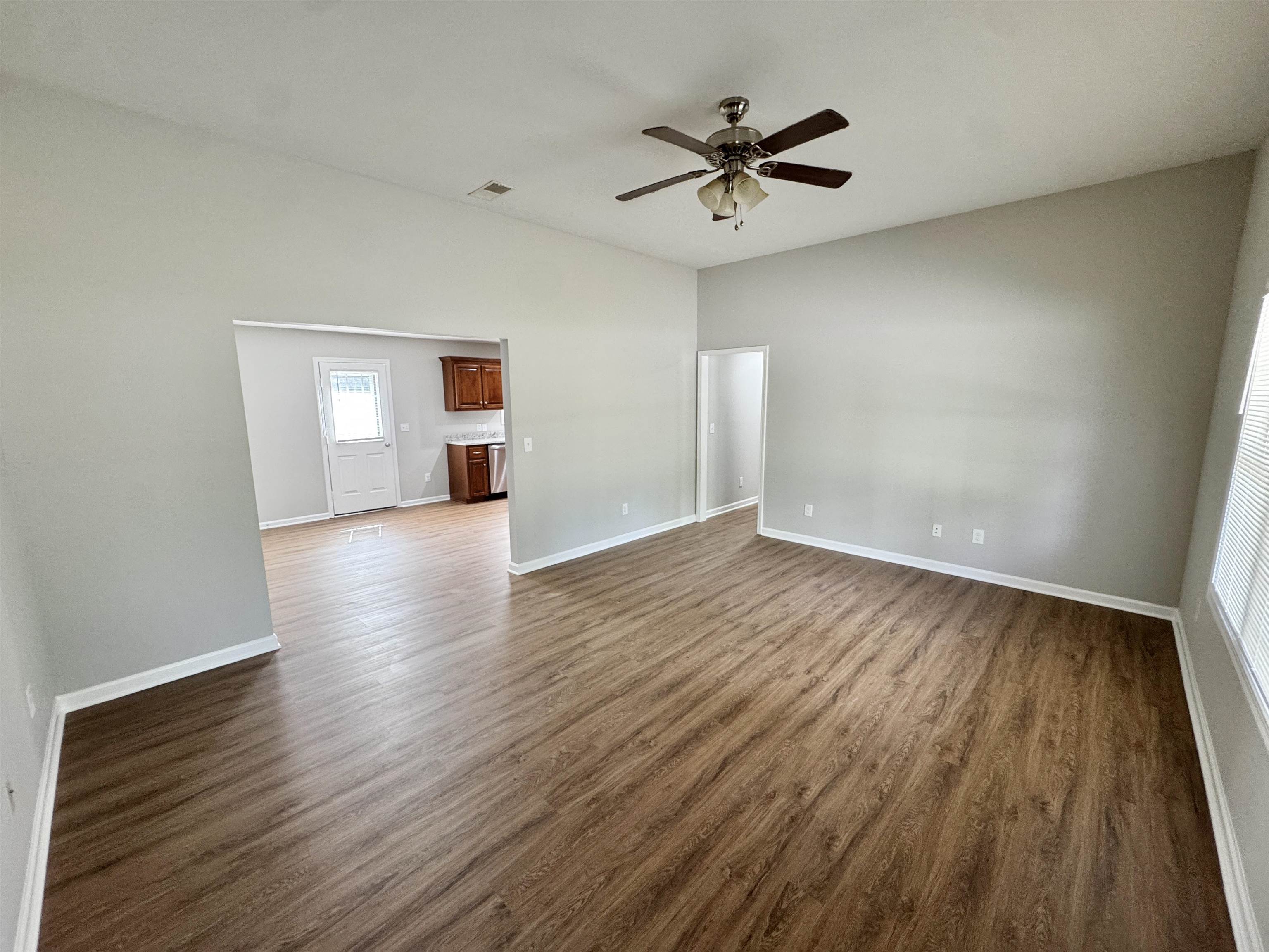 526 Stone Ridge Pinson, TN 38366 - Photo 11 of 39 Spare room with dark wood-style floors and a ceiling fan