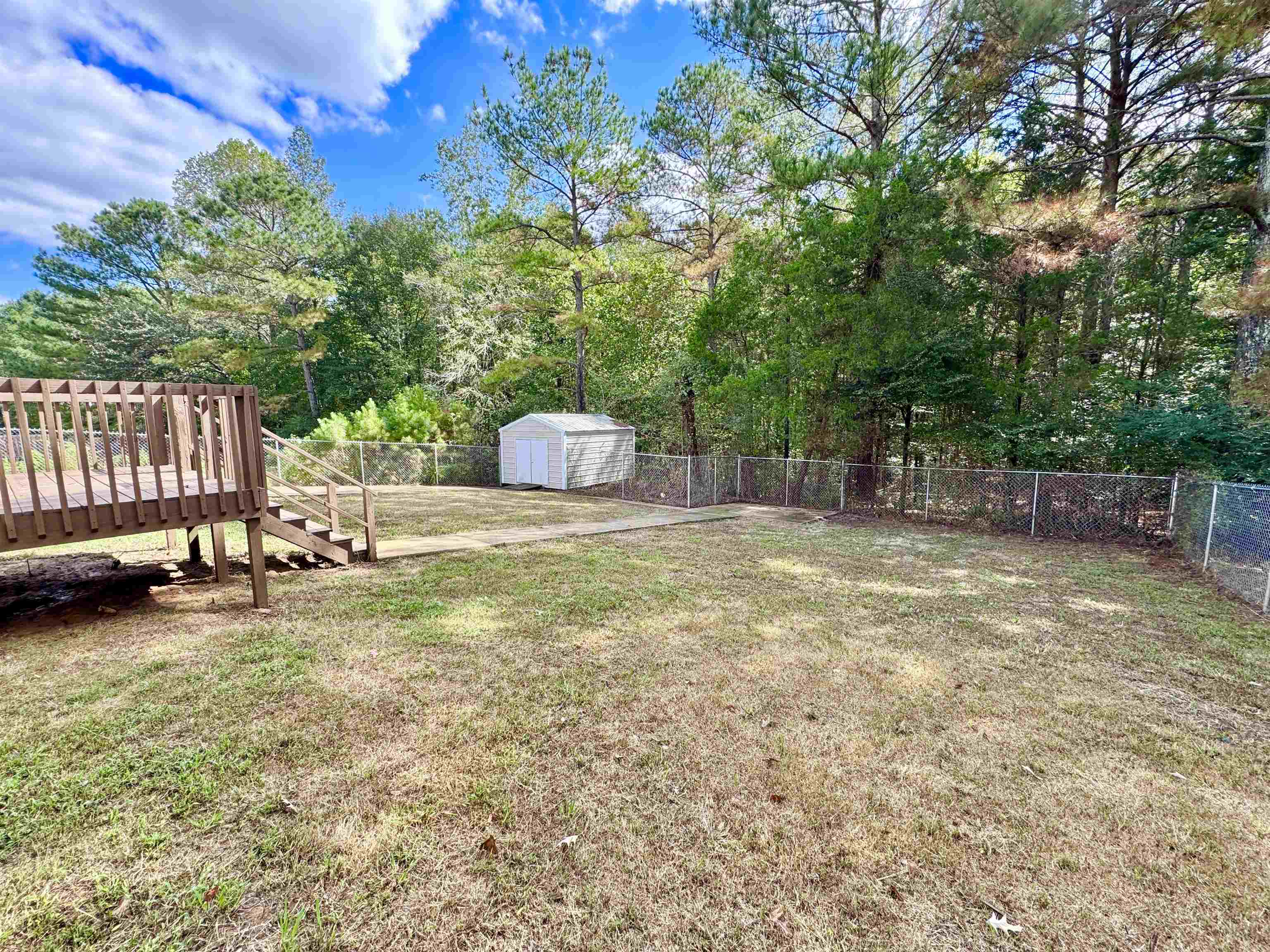 526 Stone Ridge Pinson, TN 38366 - Photo 32 of 39 Fenced backyard featuring a storage shed and stairway