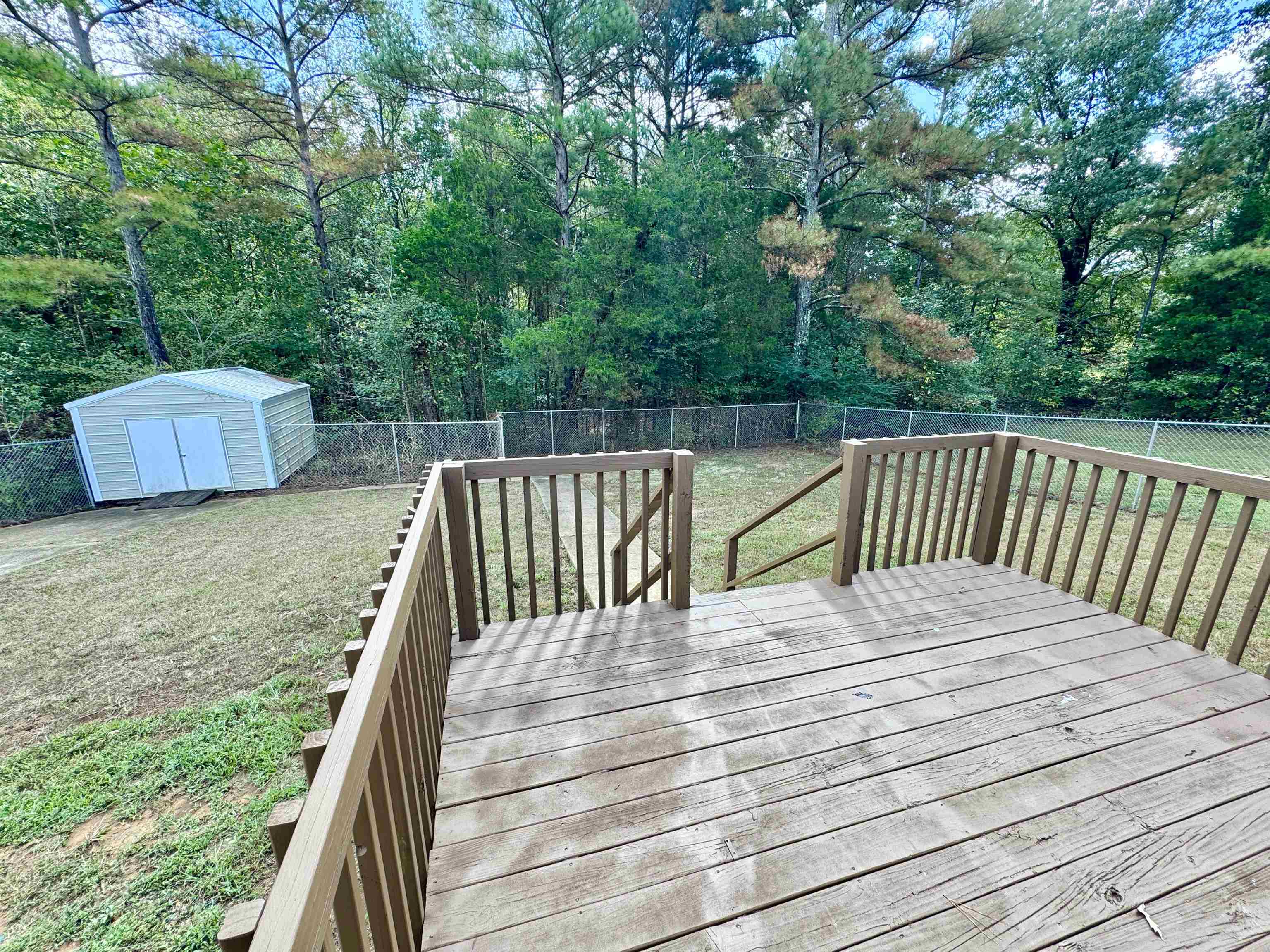 526 Stone Ridge Pinson, TN 38366 - Photo 33 of 39 Wooden deck featuring a fenced backyard and a storage shed