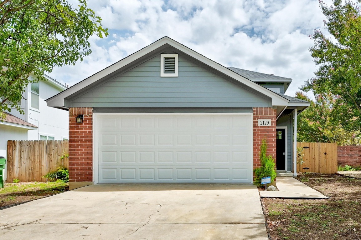a front view of a house with a garage