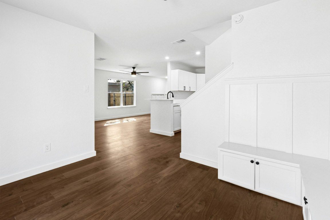 2129 Redwing Way Round Rock, TX 78664 - Photo 13 of 27 a view of a kitchen with wooden floor and electronic appliances