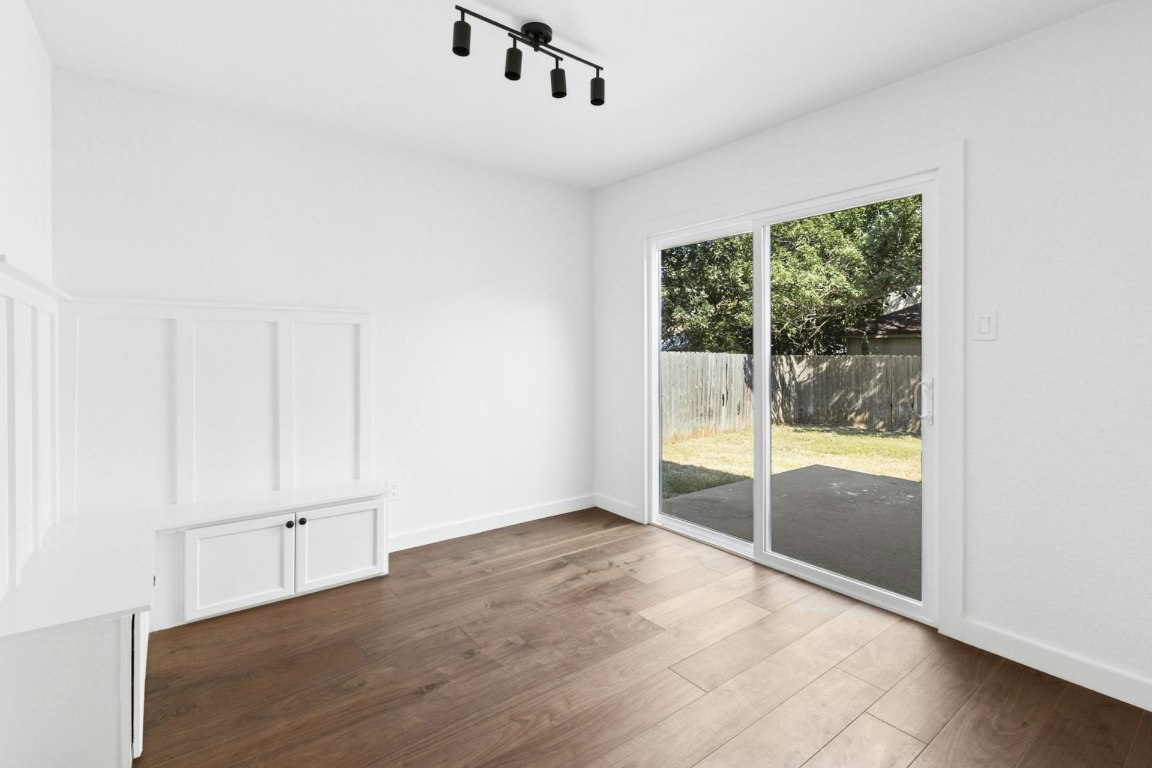 2129 Redwing Way Round Rock, TX 78664 - Photo 15 of 27 an empty room with wooden floor and windows