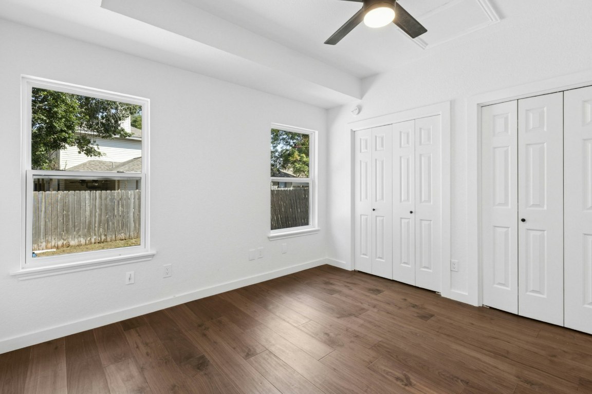 2129 Redwing Way Round Rock, TX 78664 - Photo 17 of 27 a view of an empty room with wooden floor and a window