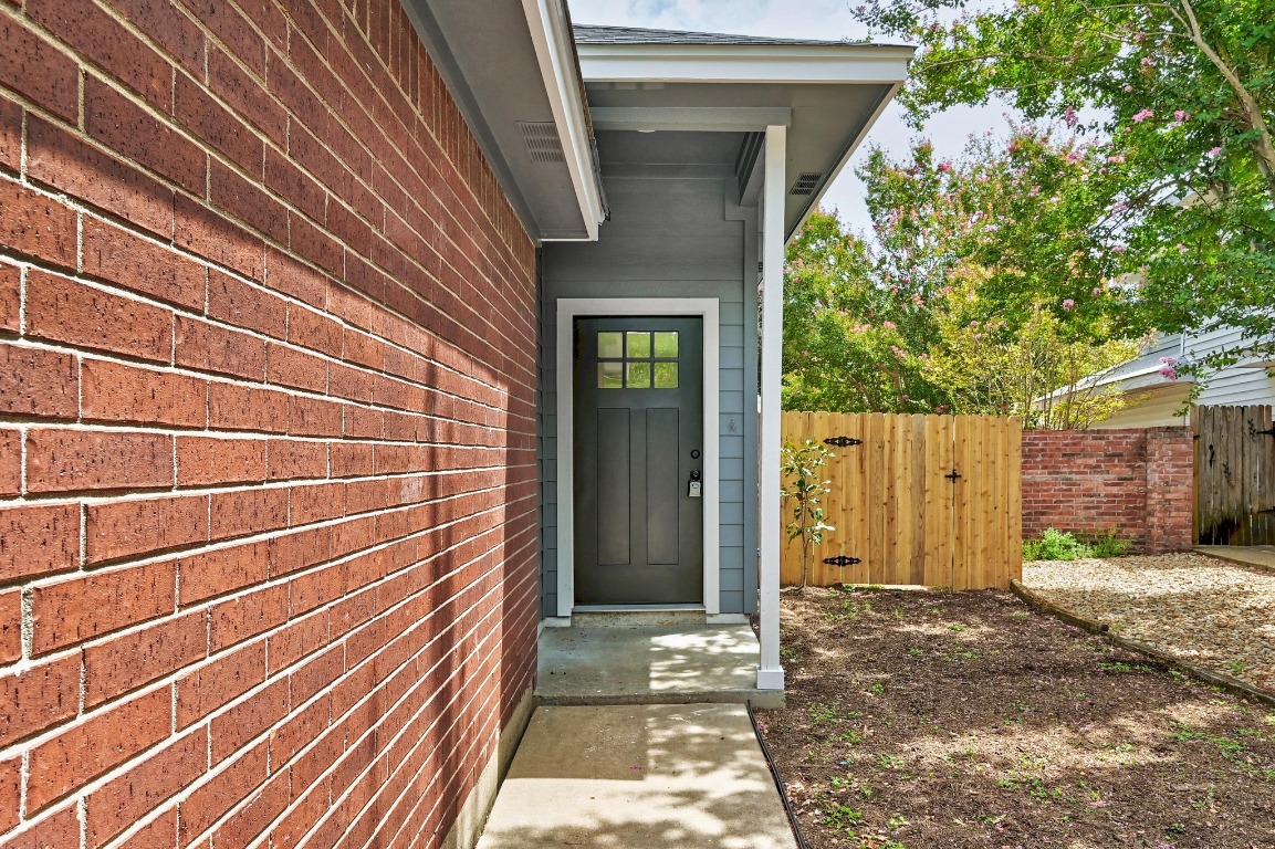 2129 Redwing Way Round Rock, TX 78664 - Photo 3 of 27 a view of a house with a door and wooden walls