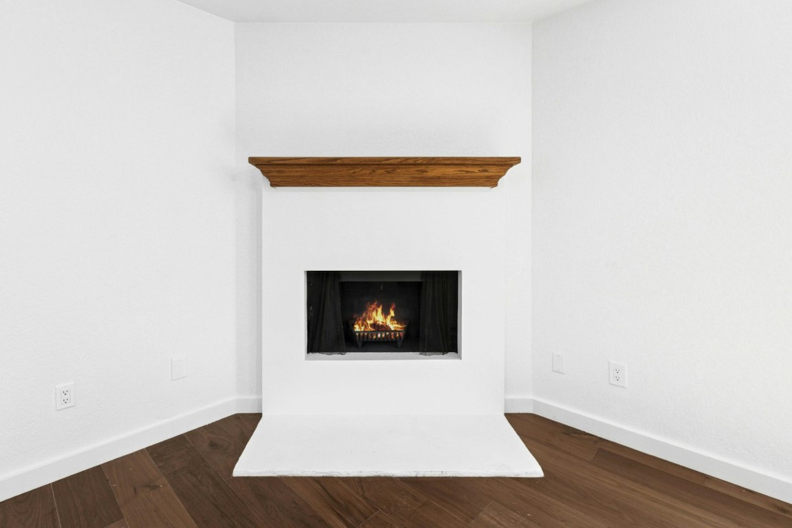 2129 Redwing Way Round Rock, TX 78664 - Photo 8 of 27 a living room with a fireplace