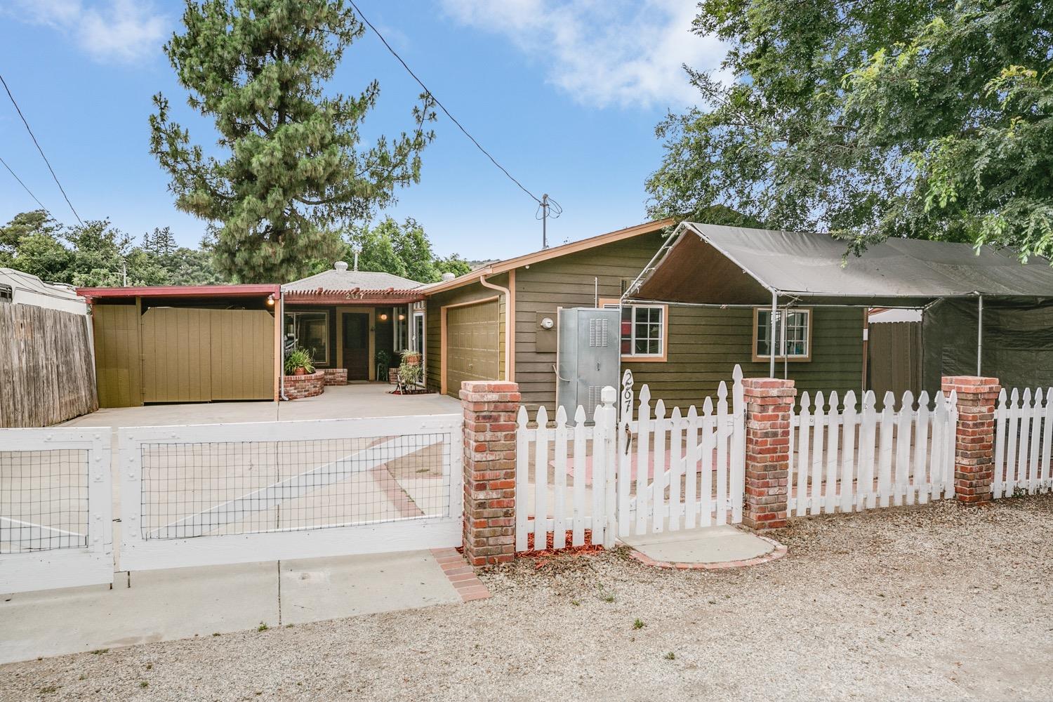 267 Burnham Road Oak View, CA 93022 - Photo 1 of 20 a front view of a house with a yard