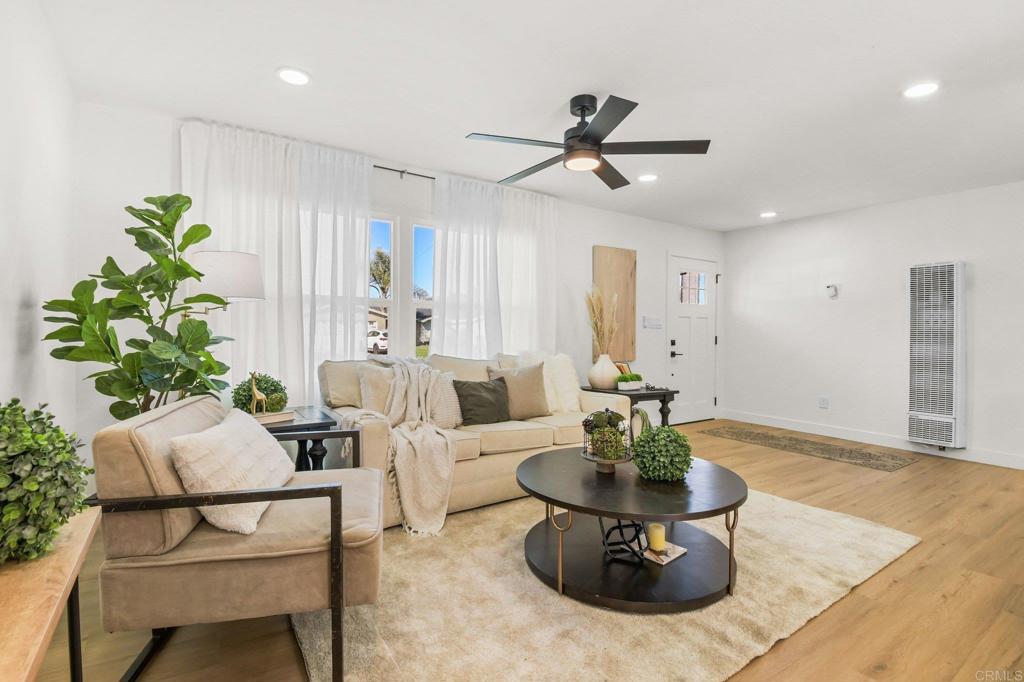 463 Parkbrook Street Spring Valley, CA 91977 - Photo 12 of 37 a living room with furniture and a chandelier