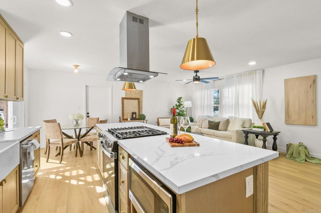 463 Parkbrook Street Spring Valley, CA 91977 - Photo 18 of 37 a view of a dining room with furniture and wooden floor