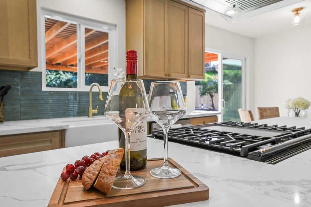 463 Parkbrook Street Spring Valley, CA 91977 - Photo 20 of 37 a table with a stove and a window