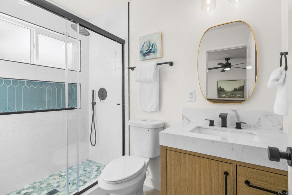 463 Parkbrook Street Spring Valley, CA 91977 - Photo 27 of 37 a bathroom with a sink a toilet and shower