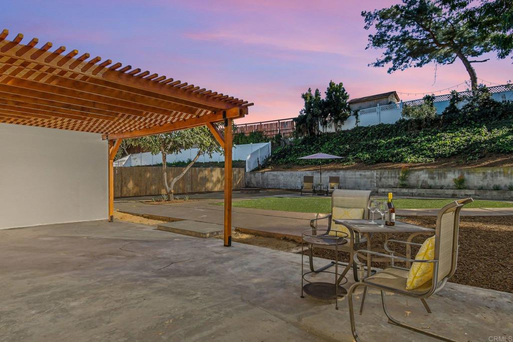 463 Parkbrook Street Spring Valley, CA 91977 - Photo 35 of 37 a view of a swimming pool with a lounge chair and floor to ceiling window