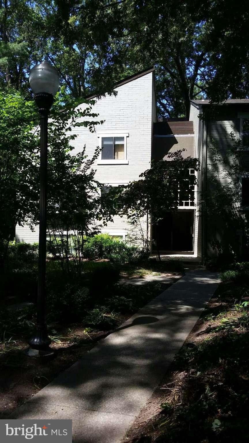 11727 Ledura Court, Unit T2 Reston, VA 20191 - Photo 1 of 18 a view of street along with trees
