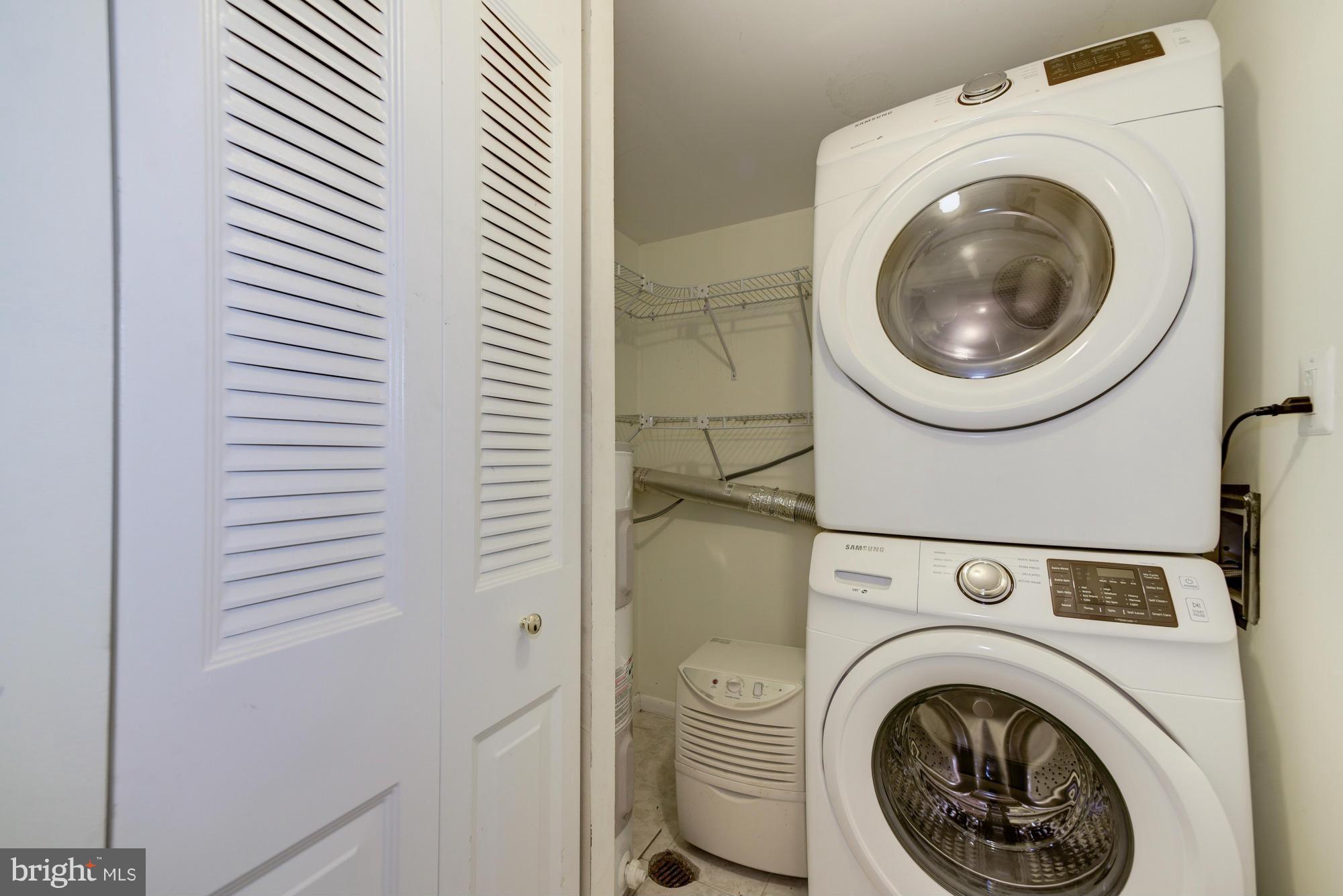 11727 Ledura Court, Unit T2 Reston, VA 20191 - Photo 17 of 18 a view of a hallway with washer and dryer