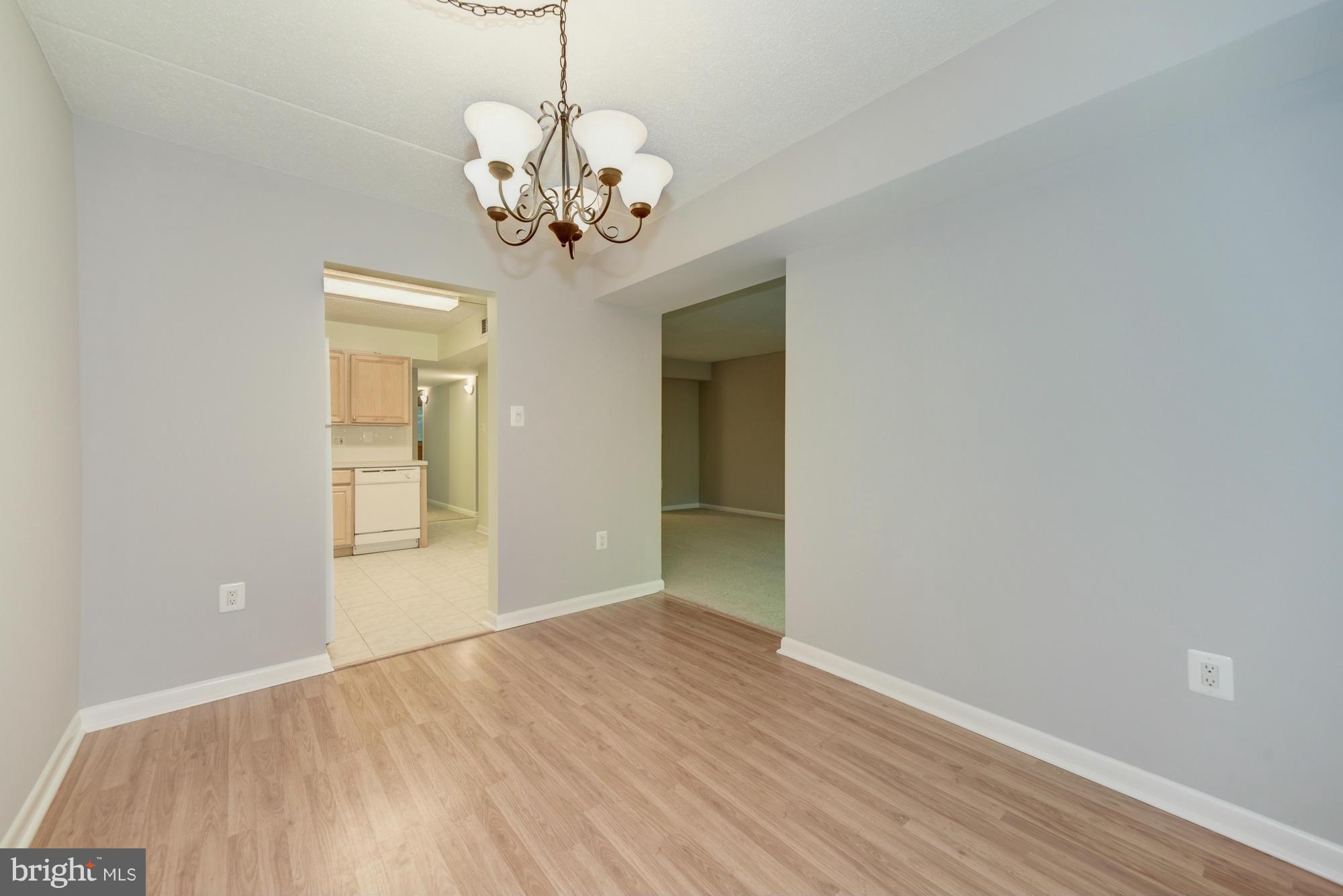 11727 Ledura Court, Unit T2 Reston, VA 20191 - Photo 7 of 18 a view of an empty room with wooden floor