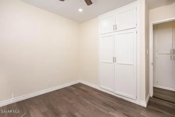 an empty room with wooden floor
