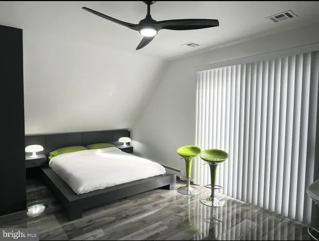 a bedroom with a bed and a table