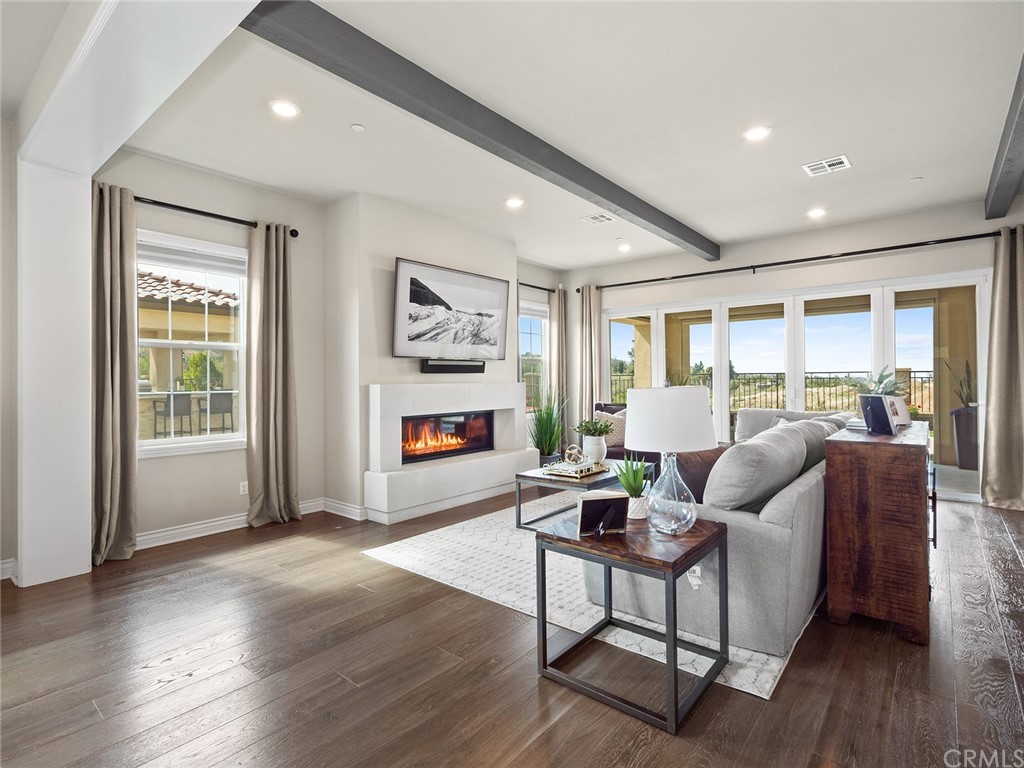 16094 Mariposa Avenue Riverside, CA 92504 - Photo 11 of 72 a living room with furniture and a window
