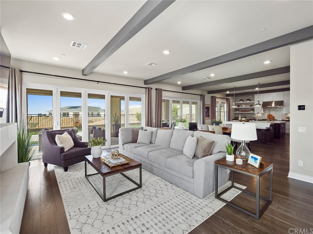16094 Mariposa Avenue Riverside, CA 92504 - Photo 12 of 72 a living room with furniture and a large window