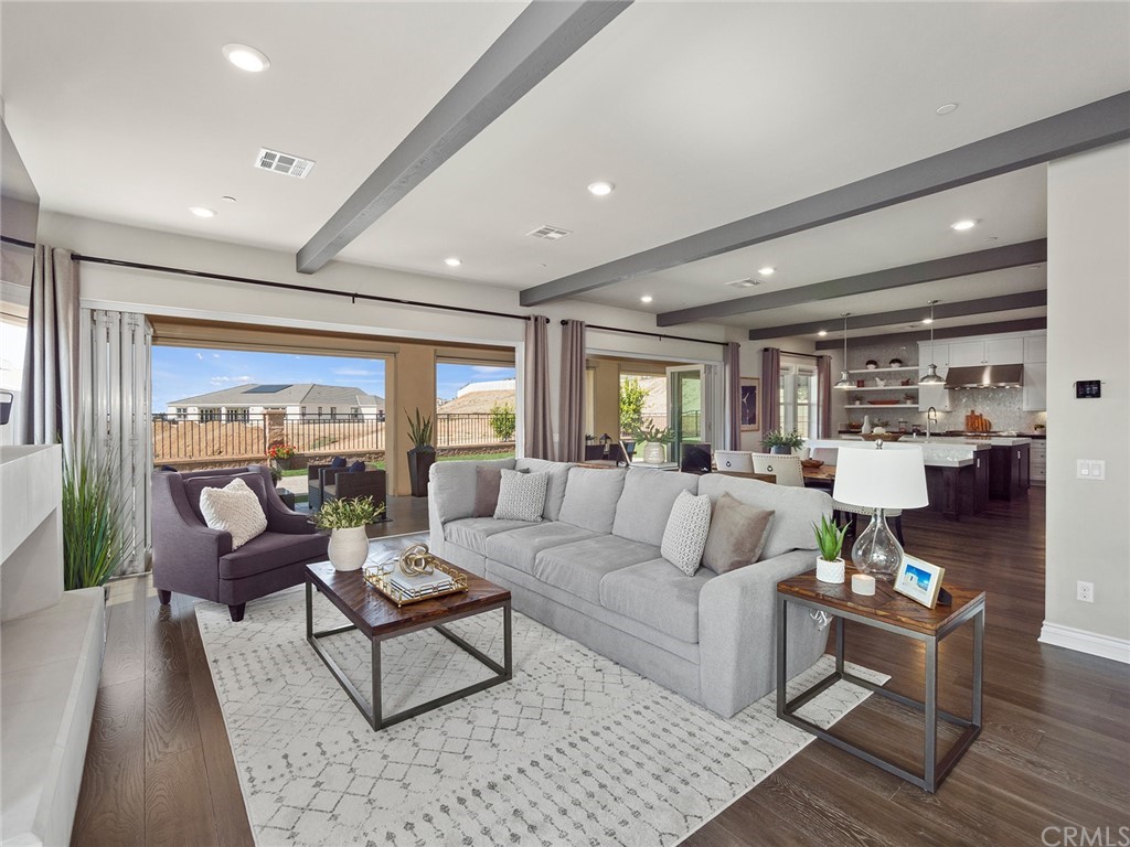 16094 Mariposa Avenue Riverside, CA 92504 - Photo 13 of 72 a living room with furniture and a large window