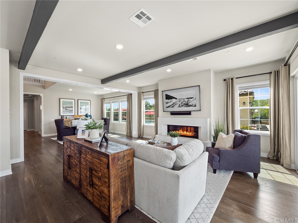16094 Mariposa Avenue Riverside, CA 92504 - Photo 16 of 72 a living room with furniture and wooden floor