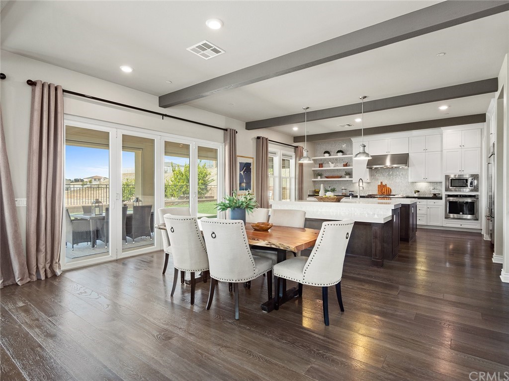 16094 Mariposa Avenue Riverside, CA 92504 - Photo 17 of 72 a dining room with furniture window and wooden floor