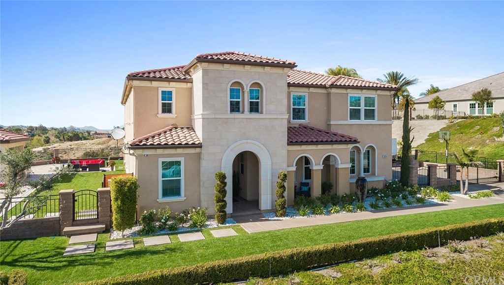 16094 Mariposa Avenue Riverside, CA 92504 - Photo 2 of 72 a front view of a house with a yard