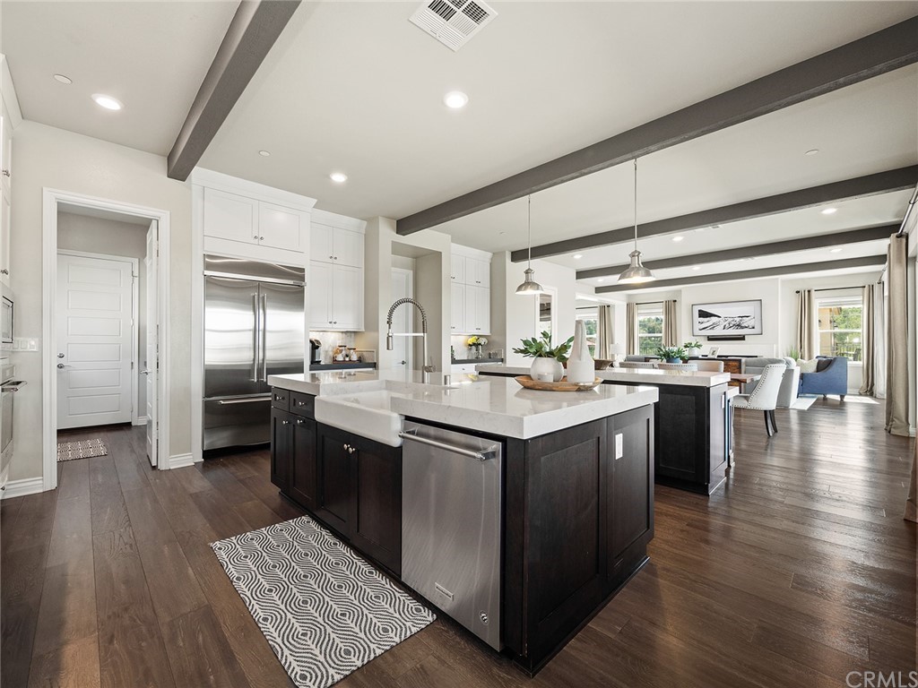 16094 Mariposa Avenue Riverside, CA 92504 - Photo 27 of 72 a kitchen with stainless steel appliances granite countertop a sink a stove and a refrigerator