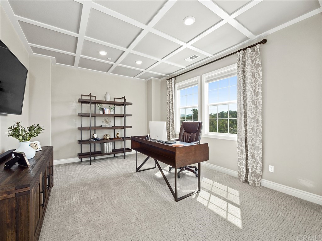 16094 Mariposa Avenue Riverside, CA 92504 - Photo 37 of 72 a living room with furniture a flat screen tv and a potted plant