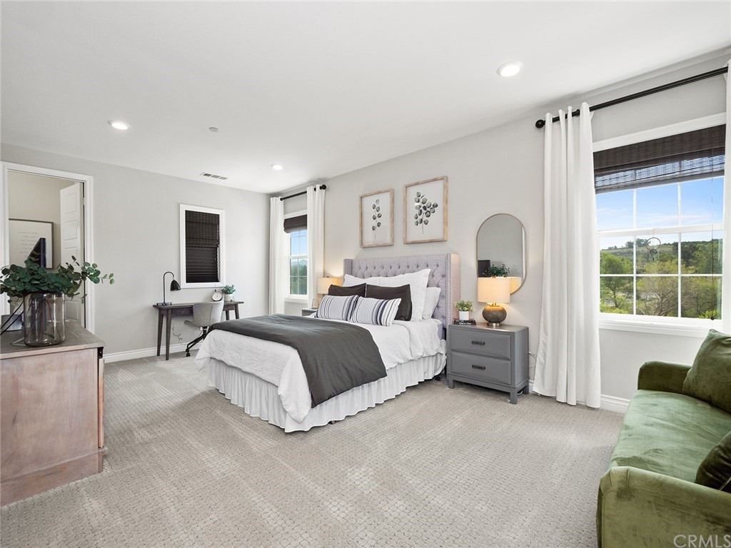 16094 Mariposa Avenue Riverside, CA 92504 - Photo 45 of 72 a bed room with furniture and a large window