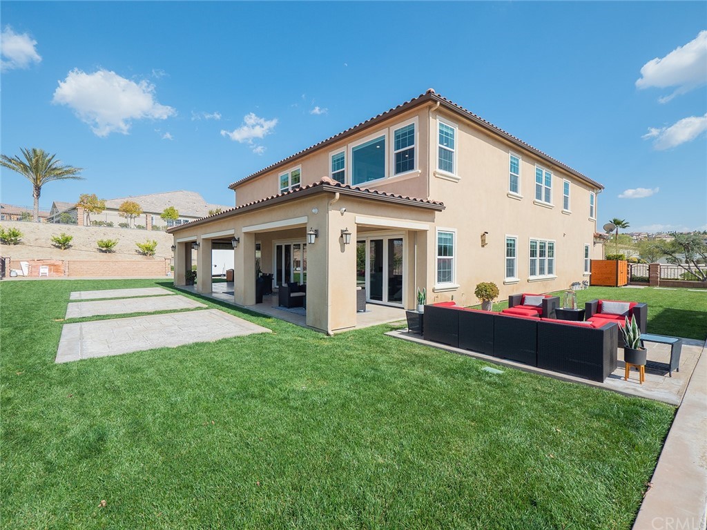 16094 Mariposa Avenue Riverside, CA 92504 - Photo 55 of 72 a front view of a house with a yard and porch