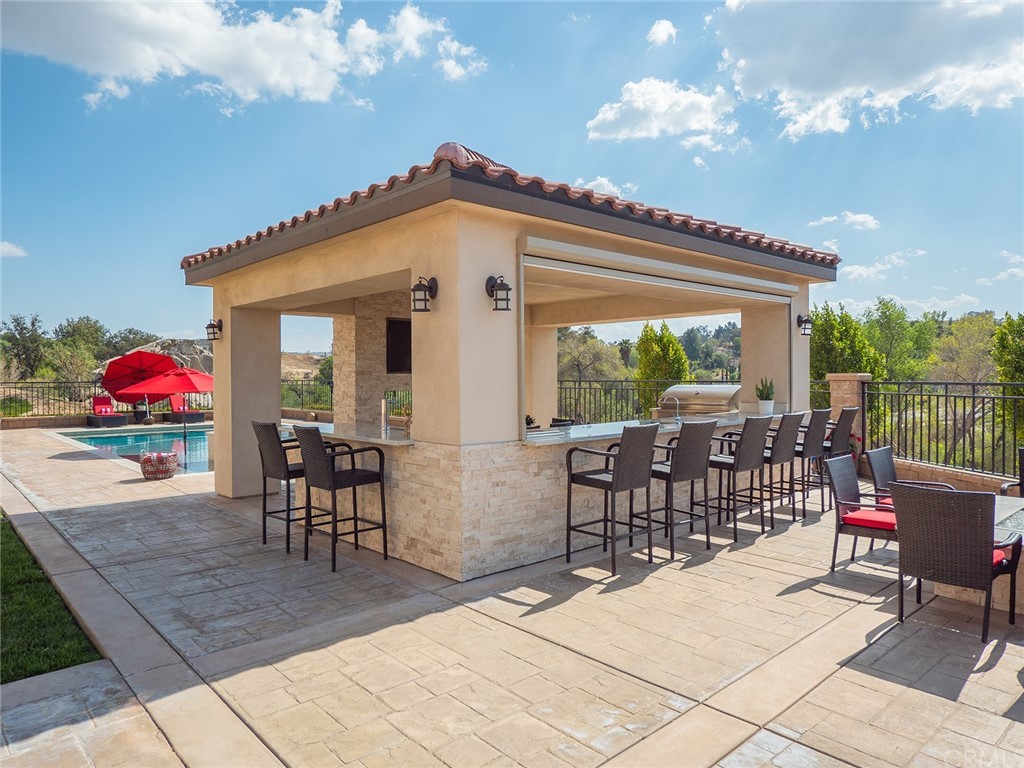 16094 Mariposa Avenue Riverside, CA 92504 - Photo 56 of 72 a view of a patio with a table and chairs