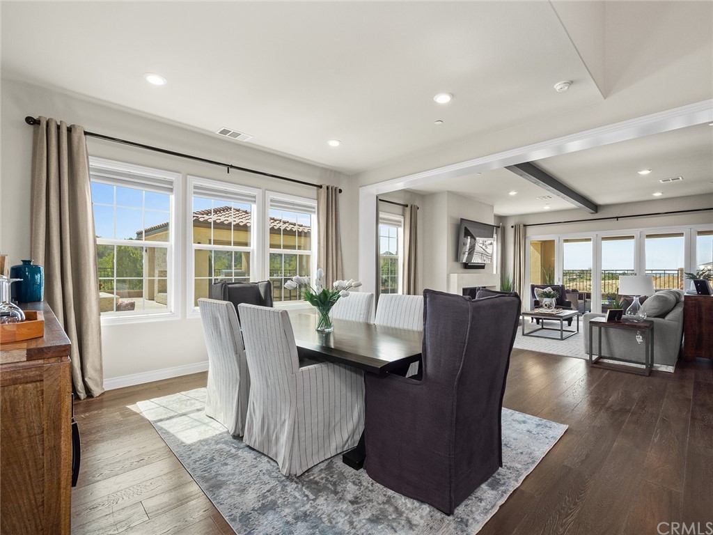 16094 Mariposa Avenue Riverside, CA 92504 - Photo 10 of 72 a dining room with wooden floor and glass windows