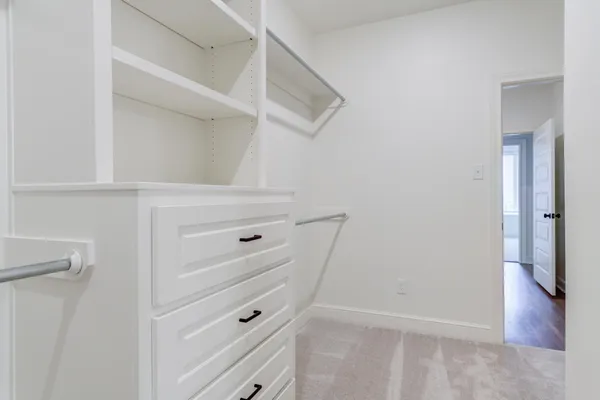 a view of an empty walk in closet