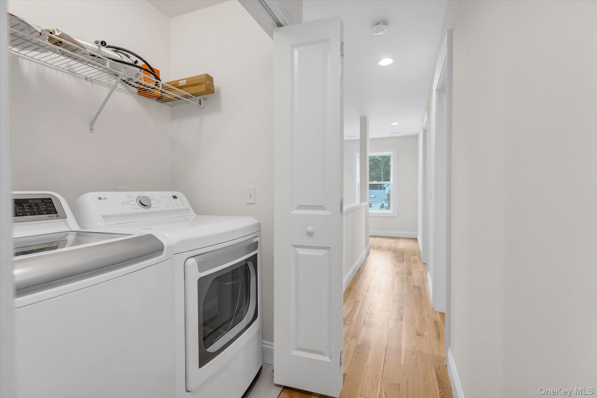 135 Elizabeth Way Ridge, NY 11961 - Photo 17 of 24 a view of storage and utility room with washer and dryer