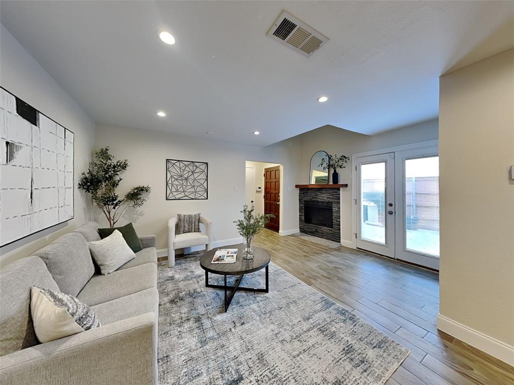 Living area featuring recessed lighting, wood finished floors, visible vents, french doors, and baseboards