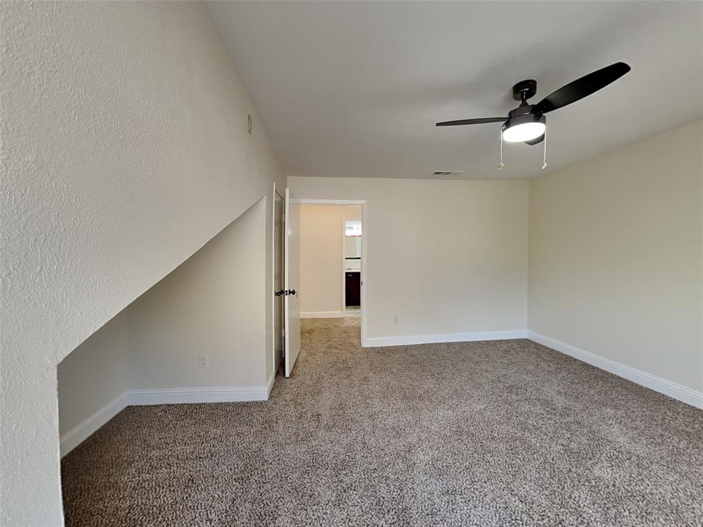 4220 Madera Road Irving, TX 75038 - Photo 13 of 22 Empty room featuring baseboards, visible vents, carpet, and ceiling fan