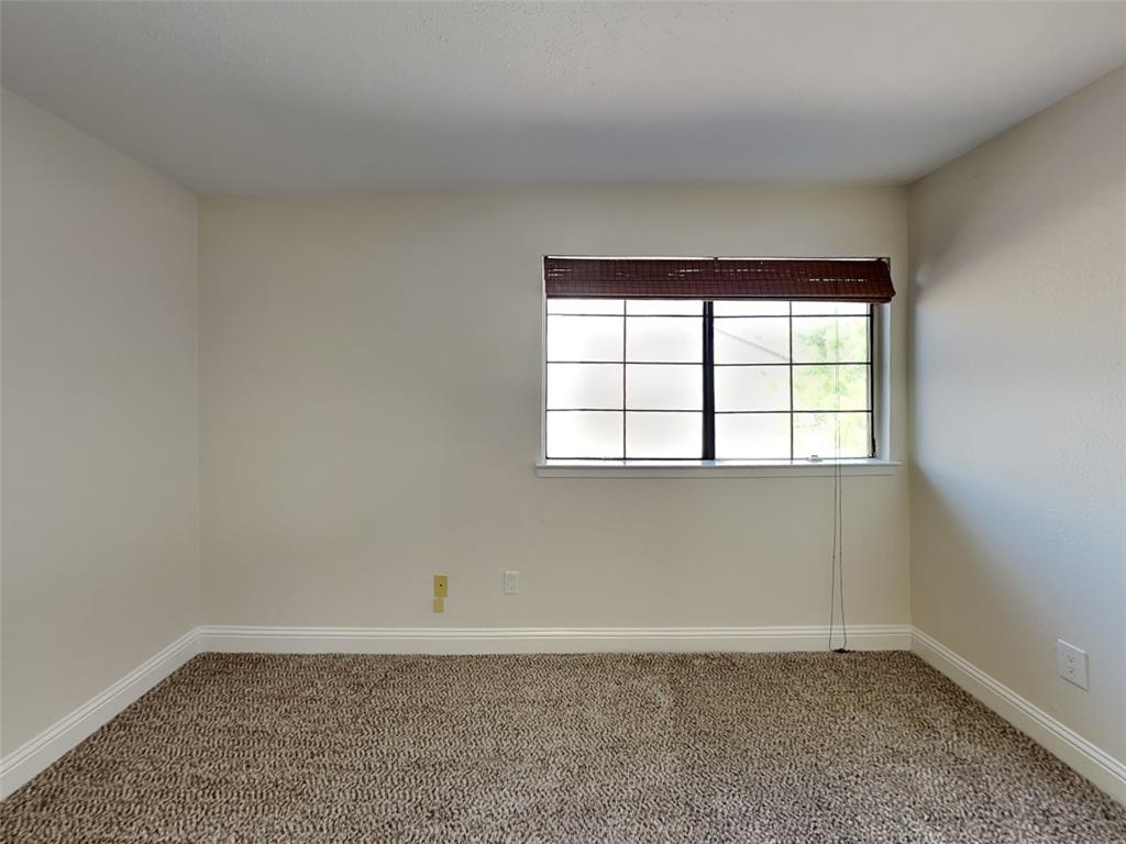 4220 Madera Road Irving, TX 75038 - Photo 14 of 22 Empty room with carpet and baseboards