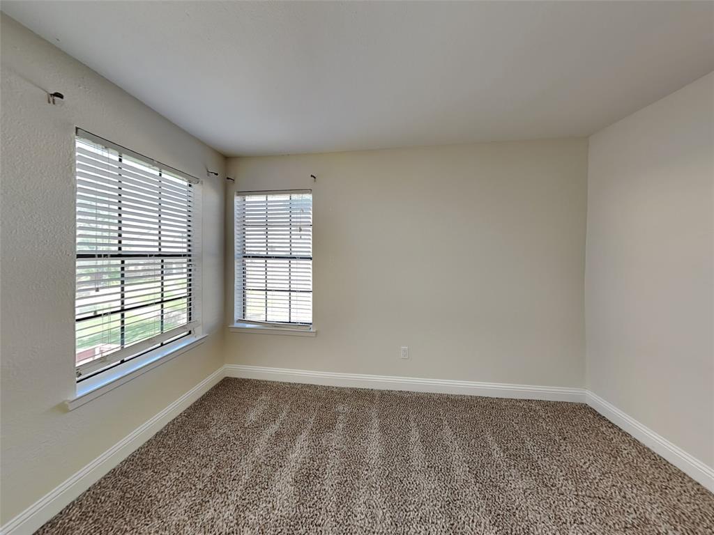 4220 Madera Road Irving, TX 75038 - Photo 19 of 22 Spare room with baseboards and carpet flooring