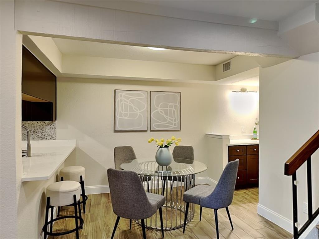 4220 Madera Road Irving, TX 75038 - Photo 2 of 22 Dining room featuring baseboards, light wood-style flooring, and visible vents