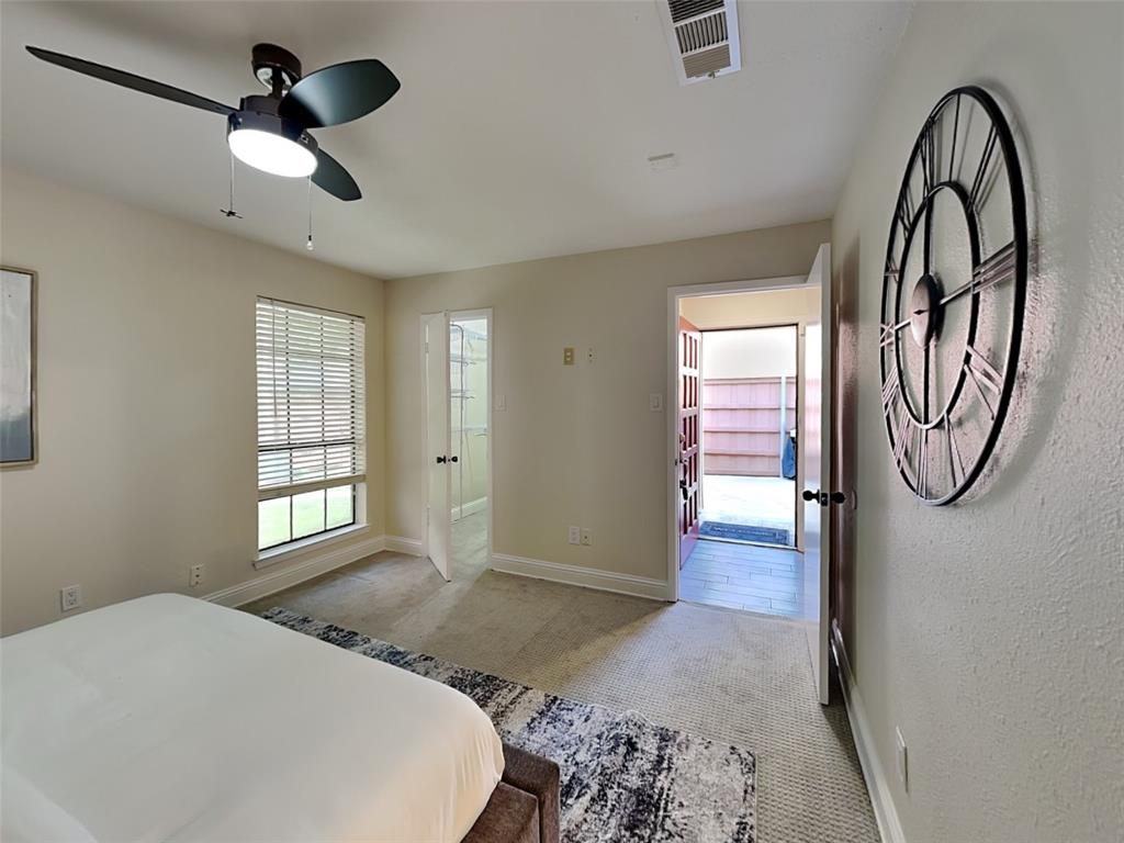4220 Madera Road Irving, TX 75038 - Photo 4 of 22 Carpeted bedroom featuring baseboards, a ceiling fan, and visible vents