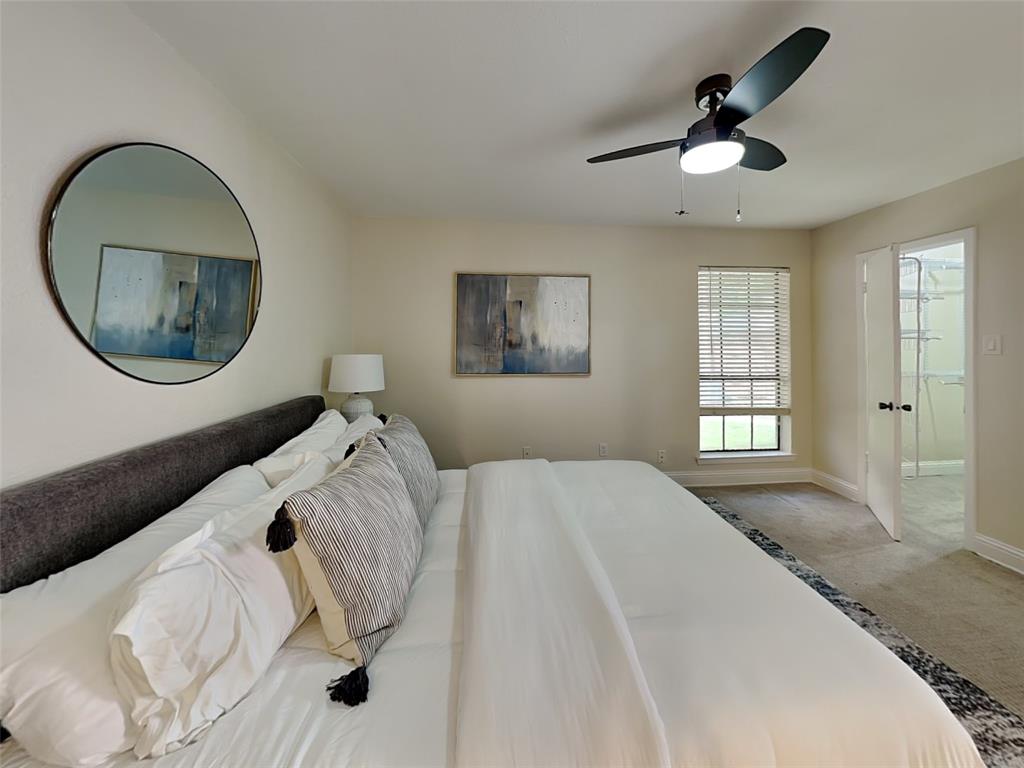4220 Madera Road Irving, TX 75038 - Photo 6 of 22 Carpeted bedroom with ceiling fan, baseboards, and ensuite bathroom