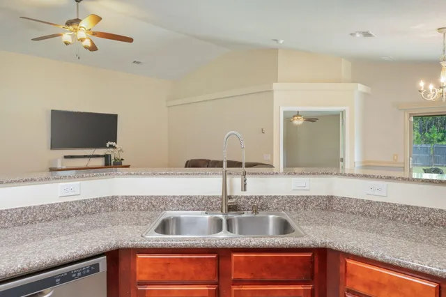 a kitchen with a sink and a microwave