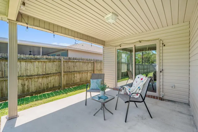 a view of a patio with garden