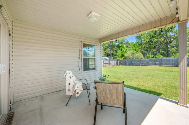a view of yard with swimming pool and green space