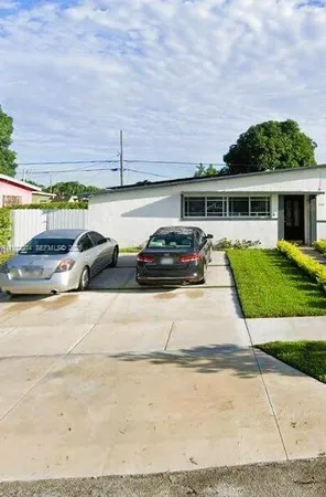 a view of a car parked in front of a building