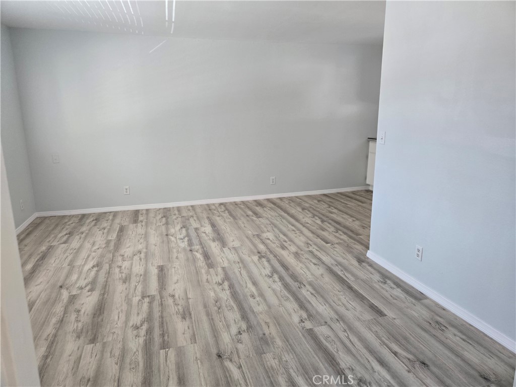 765 Iris Drive, Unit 2 Big Bear Lake, CA 92315 - Photo 4 of 7 a view of room with wooden floor