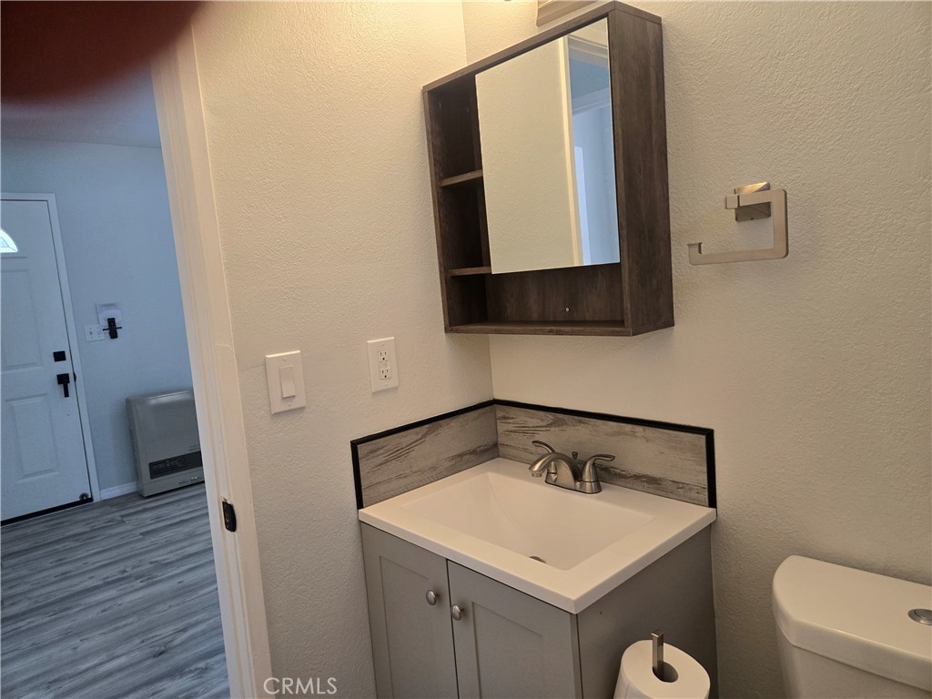 765 Iris Drive, Unit 2 Big Bear Lake, CA 92315 - Photo 7 of 7 a bathroom with a sink and a mirror