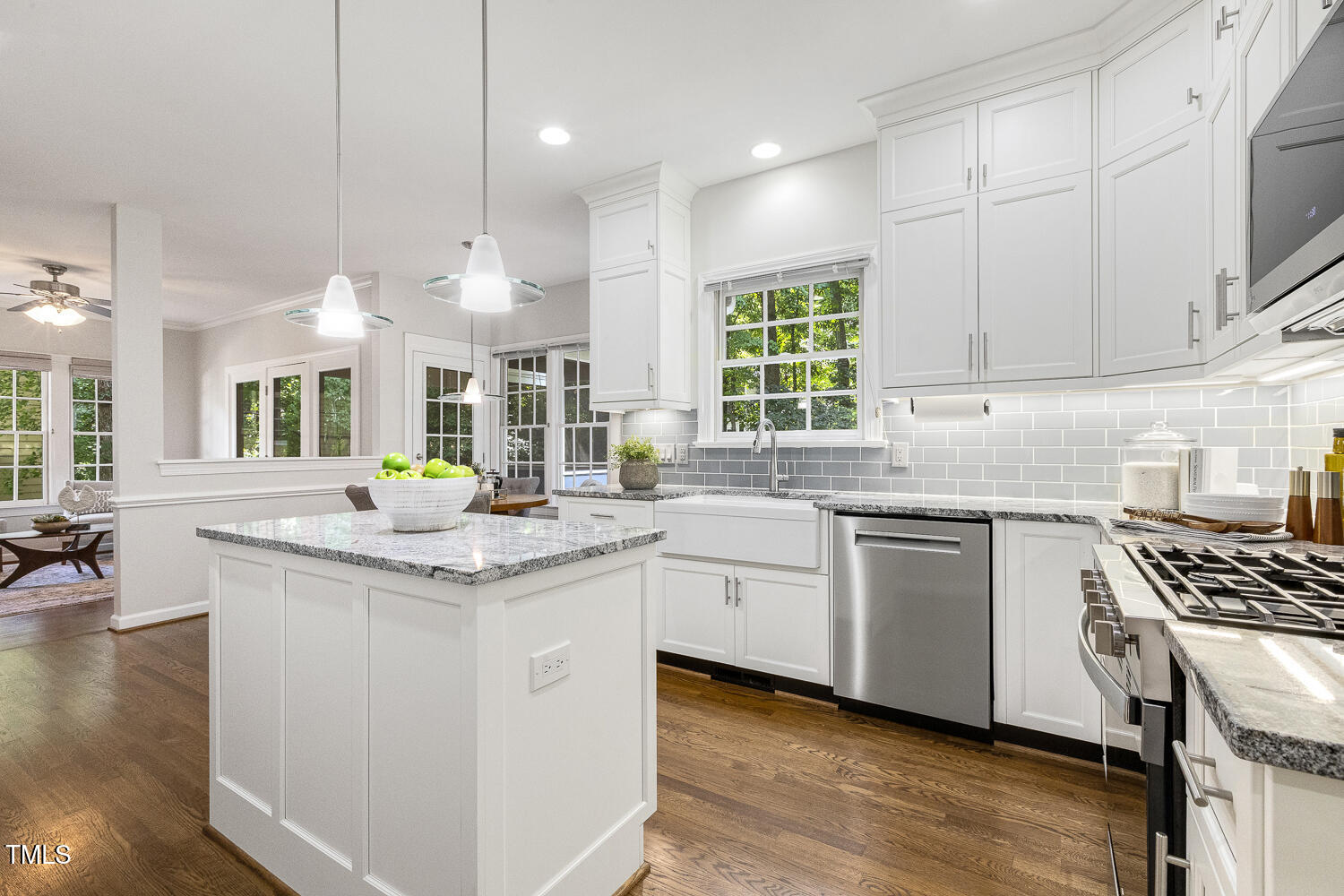 110 Felspar Way Cary, NC 27518 - Photo 13 of 71 a kitchen with stainless steel appliances granite countertop a sink stove and cabinets