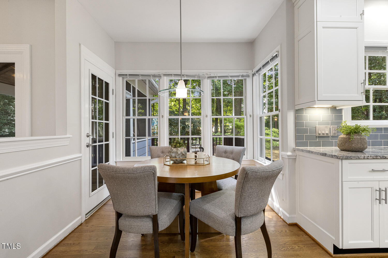110 Felspar Way Cary, NC 27518 - Photo 21 of 71 a view of a dining room with furniture window and wooden floor