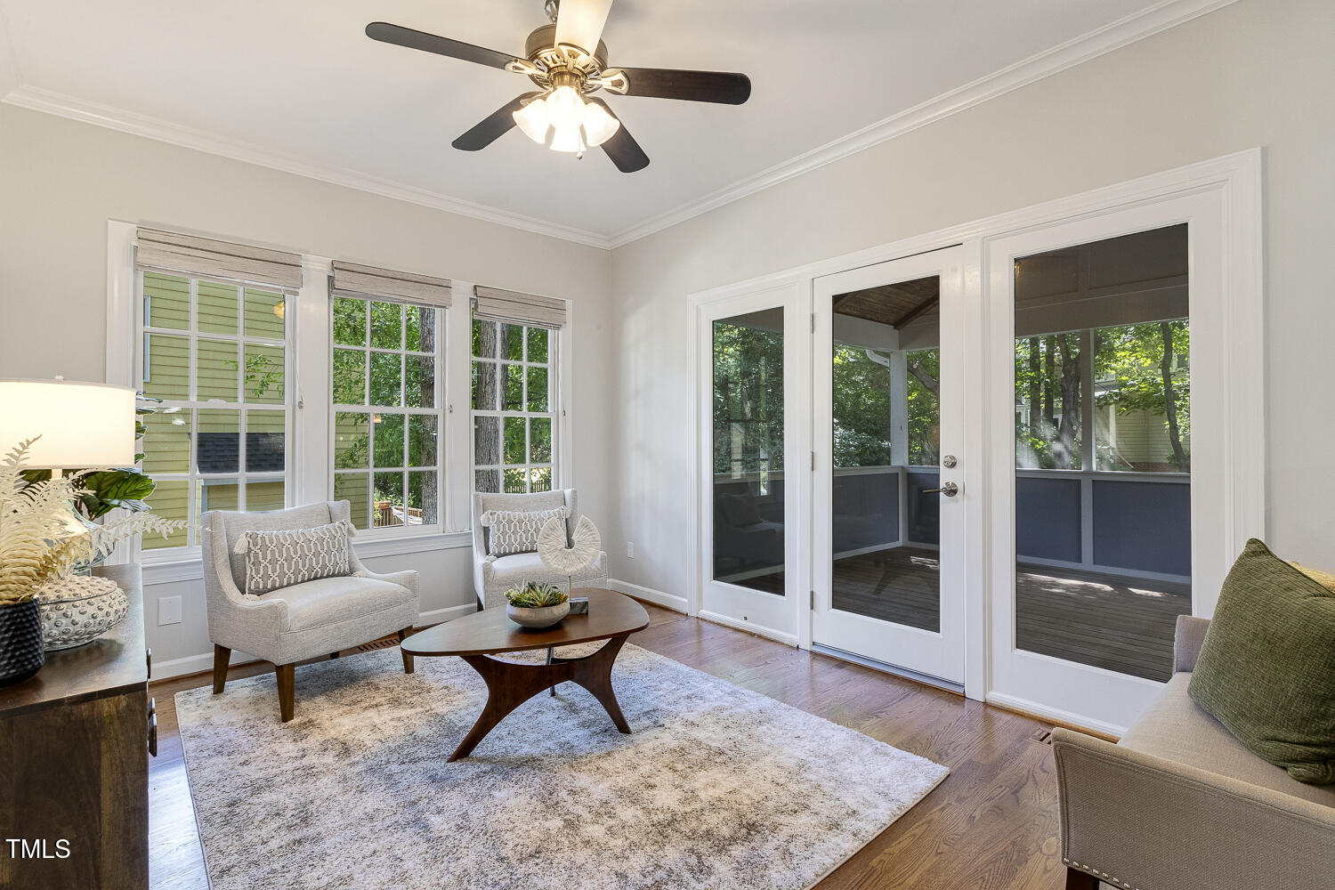 110 Felspar Way Cary, NC 27518 - Photo 22 of 71 a living room with furniture and a floor to ceiling window